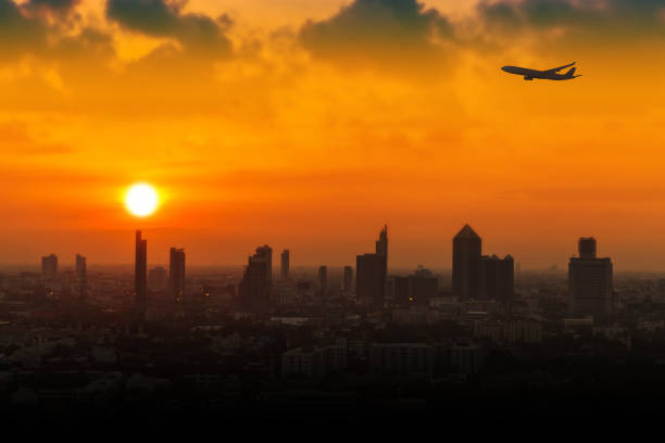 istock Silhouette of airplane flying 641772346