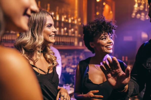istock Group of young friends enjoying a night at pub 641774594