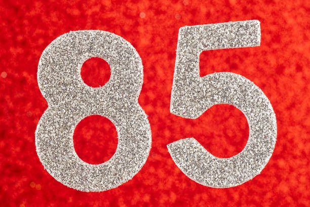 istock Number eighty-five silver color over a red background. Anniversary. 641775032