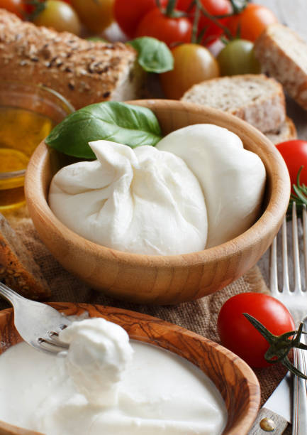 istock Italian cheese burrata, tomatoes, basil and bread 641776994