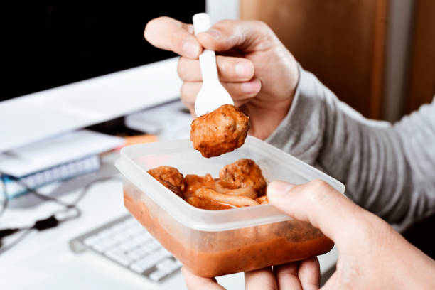 young man eating at the office