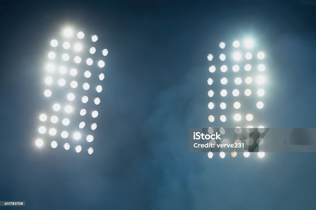 stadium lights and smoke Floodlight Stock Photo