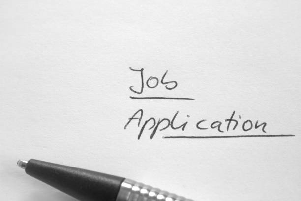 istock Handwritten phrase 'Job Application' on white paper 641783796