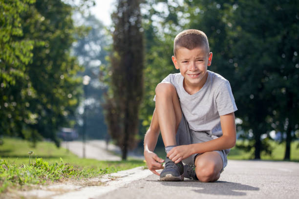 istock Teenage boy Tying a shoelace 641785496