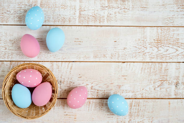 istock Easter eggs over white wooden vintage table 641786126