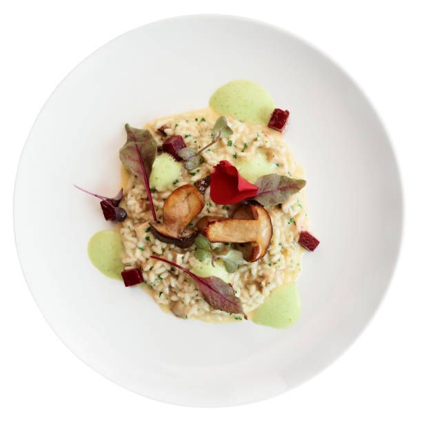 istock Risotto with fried porcini mushrooms isolated on white 641789424