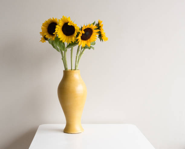 istock Sunflowers in yellow vase 641791226