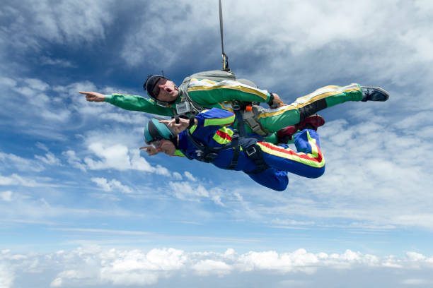 istock Tandem jump. The girl with the instructor in freefall. 641791774