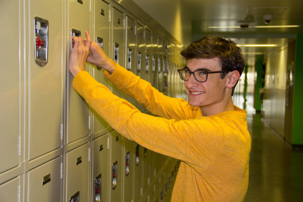 istock Teen Unlocking Locker in Hallway 641792828