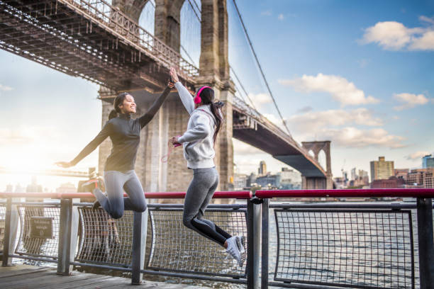 istock Athletes giving high-five against Brooklyn bridge 641796502