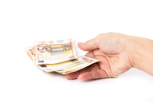istock Female hand holding 50 euro banknotes 641796948