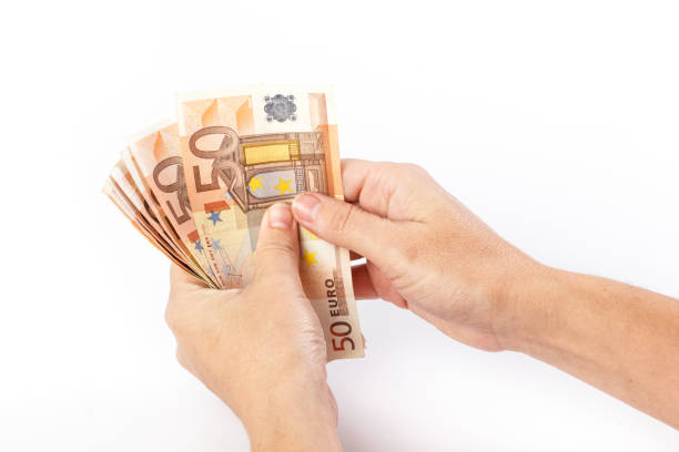istock Female hand holding 50 euro banknotes 641796950