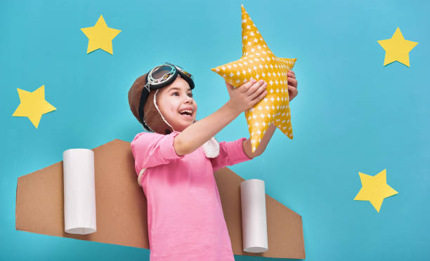 istock girl in an astronaut costume 641798152