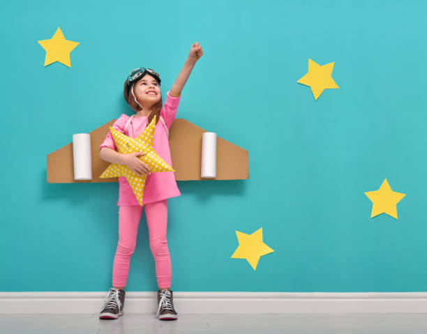 istock girl in an astronaut costume 641798158