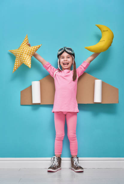 istock girl in an astronaut costume 641798172