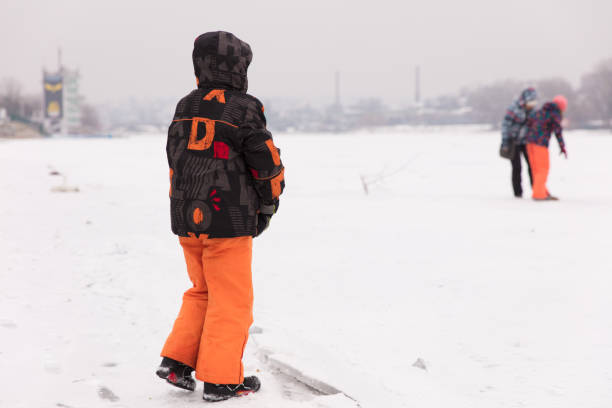 istock Little boy on frozen lake 641798346