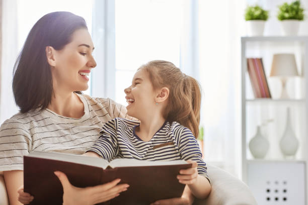 istock mother and daughter reading a book 641798418