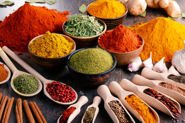 istock Variety of spices and herbs on kitchen table 641799406