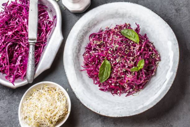 istock Cabbage salad with soybean sprouts and edible garlic flowers 641799872