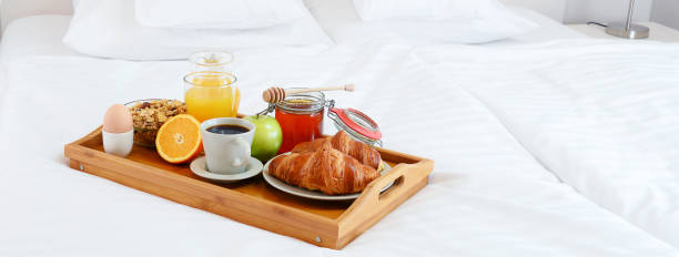 istock Breakfast in bed in hotel room. 641800216
