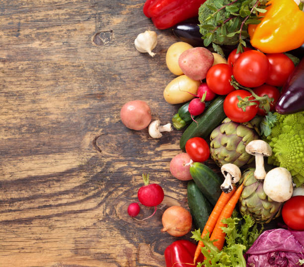 istock Fresh vegetables on wooden background. 641800520