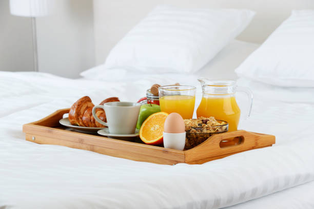 istock Breakfast in bed in hotel room. 641800776