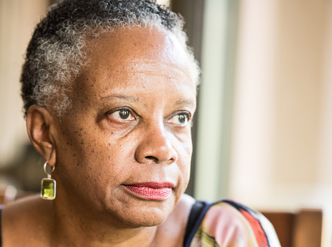 Sad senior african american woman looking away