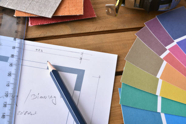 istock Closeup table with house plan and tools of a decorator 641804930