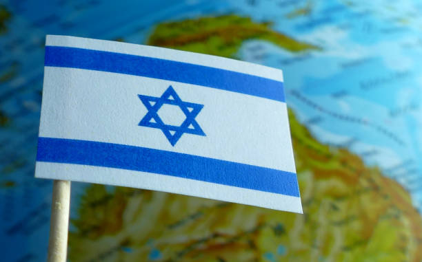 istock Israel flag with a globe map as a background macro 641805284
