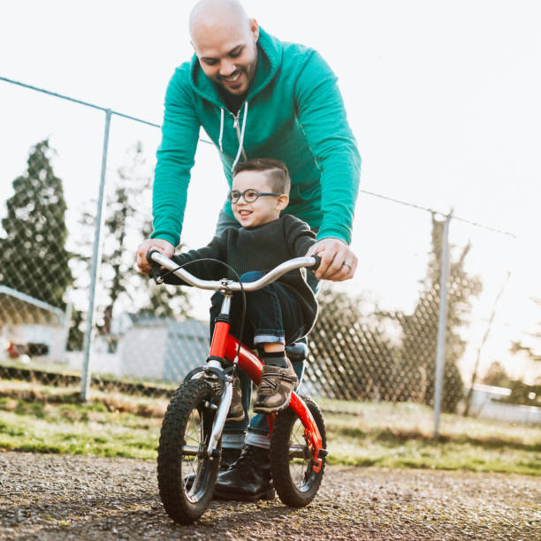 istock Dad Teaching Son to Ride Bike 641805812