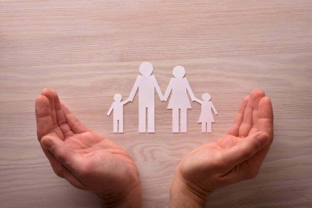 istock Concept of family protection with hands around protecting them 641806406
