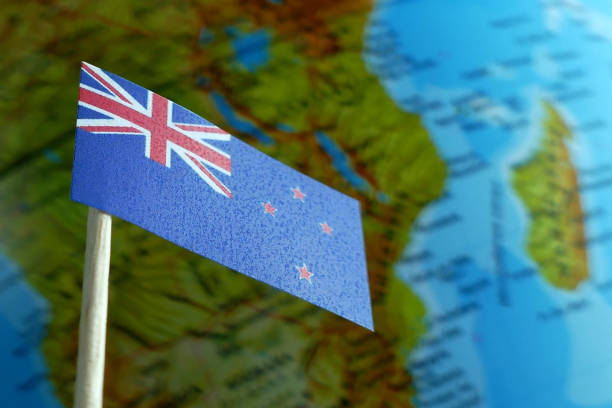 istock New Zealand flag with a globe map as a background 641806760