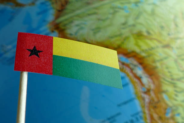 istock Guinea Bissau flag with a globe map as a background 641807928