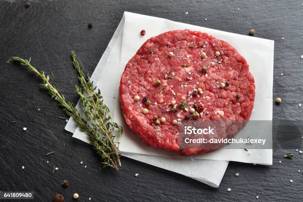 Fresh Raw Prime Black Angus Beef Burger Patty Stock Photo - Download Image Now - Backgrounds, Beef, Black Angus Cattle