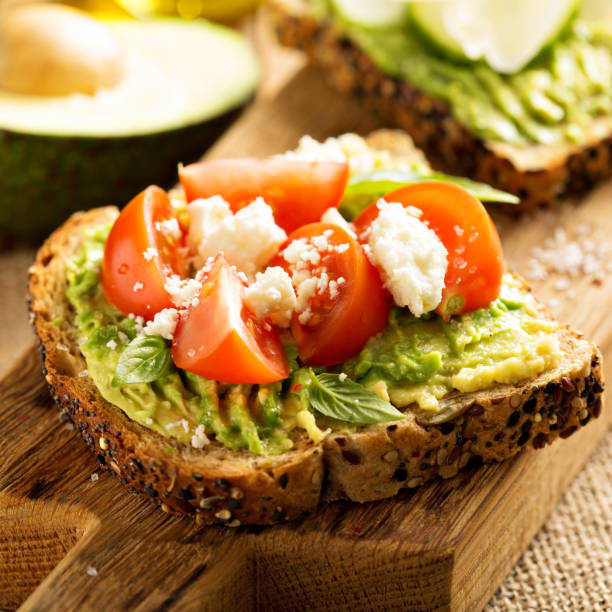 istock Avocado toast with tomatoes and feta 641809868