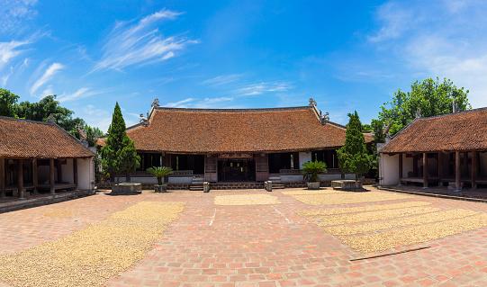 Front exterior view of Mong Phu communal house, a national relic in Duong Lam ancient village, Son Tay district, Hanoi, Vietnam