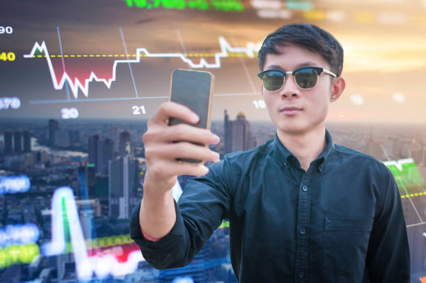 istock Young business man using smart phone and digital tablet cityscape background 641811880