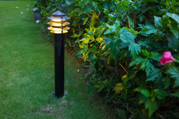 istock Illuminated outdoor light in apartment garden at twilight, evening 641815004