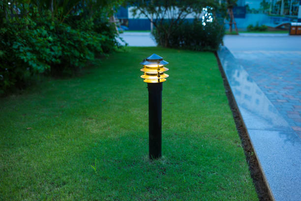 istock Illuminated outdoor light in apartment garden at twilight, evening 641815044