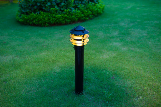 istock Illuminated outdoor light in apartment garden at twilight, evening 641815132