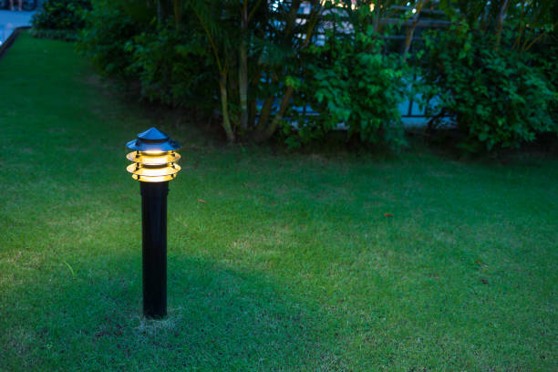 istock Illuminated outdoor light in apartment garden at twilight, evening 641815348