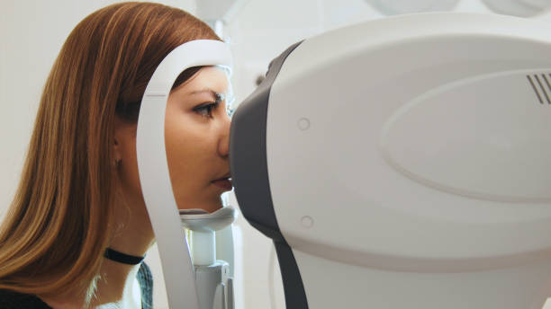 istock Ophthalmology clinic concept - young attractive female doing checking vision by modern electronic technology 641815670