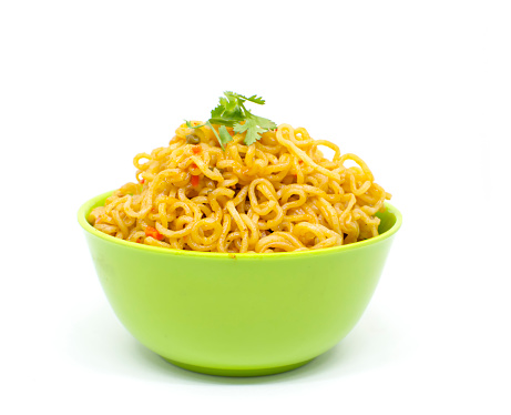 Tasty noodles in green bowl with white background