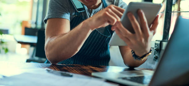 istock Managing his coffee shop the smart way 641828758