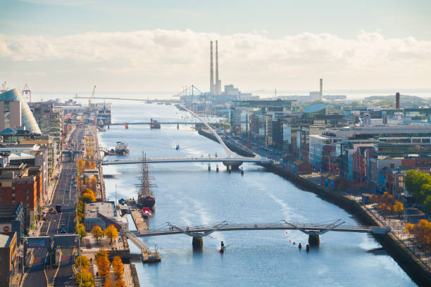 Skyline of Dublin City, Ireland The skyline of Dublin City, Ireland looking east along the quays towards the docklands area dublin republic of ireland photos stock pictures, royalty-free photos & images