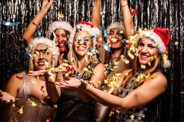 istock Girls throwing confetti on a party 641830310