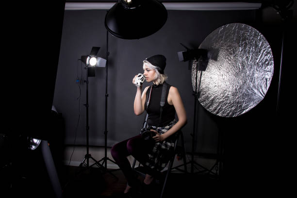 istock Female Hipster Photographer Drinking Coffee 641830674