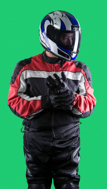 Close-up of a motorcyclist riding motorcycle outdoors