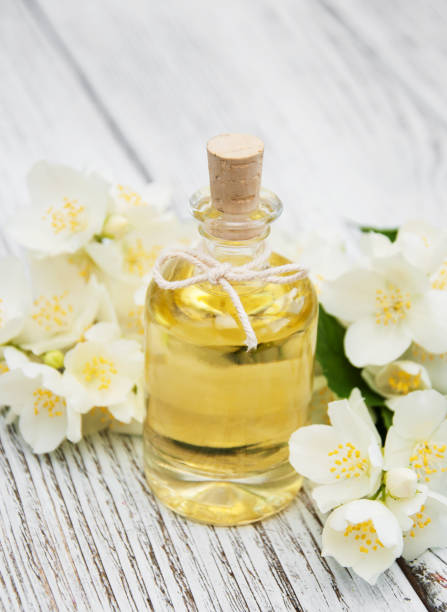 istock Massage oil with jasmine flowers 641830832