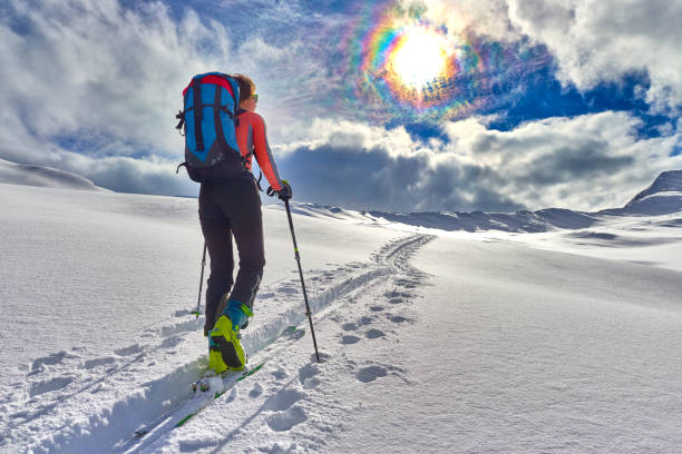 istock Girl makes ski mountaineering alone toward the mountain pass 641830876